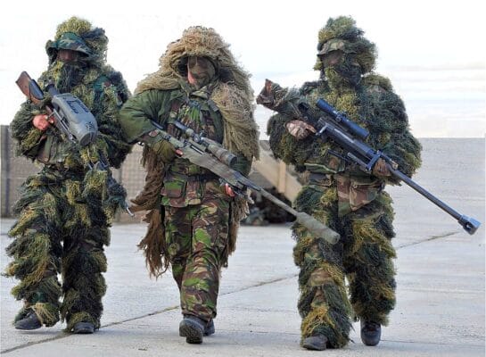British and French Snipers ln camouflage Ghillie suits during Ex Boars Head edited background changed